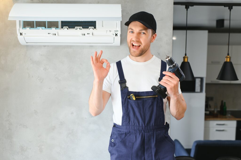 expertacfix.com-service-man-is-cleaning-repair-maintenance-air-conditioner