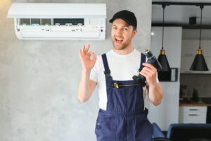 expertacfix.com-service-man-is-cleaning-repair-maintenance-air-conditioner